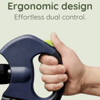 Close-up of a hand gripping an ergonomic handle with a bright green button, showcasing effortless dual control and modern design for pet products.